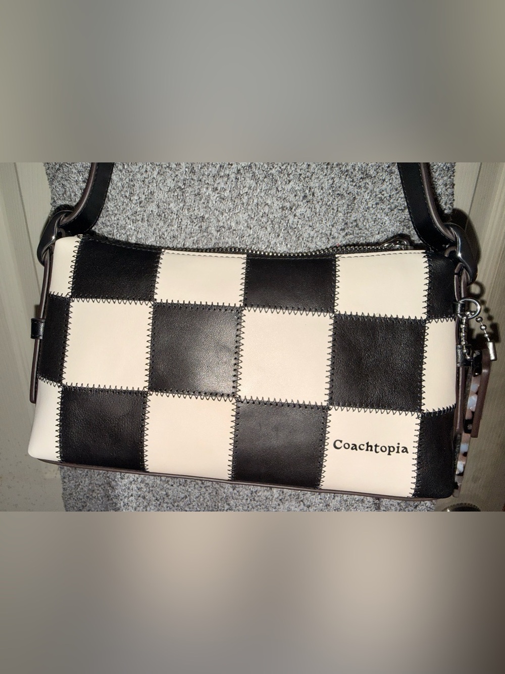 Small black and white checkered coach alter ego bag